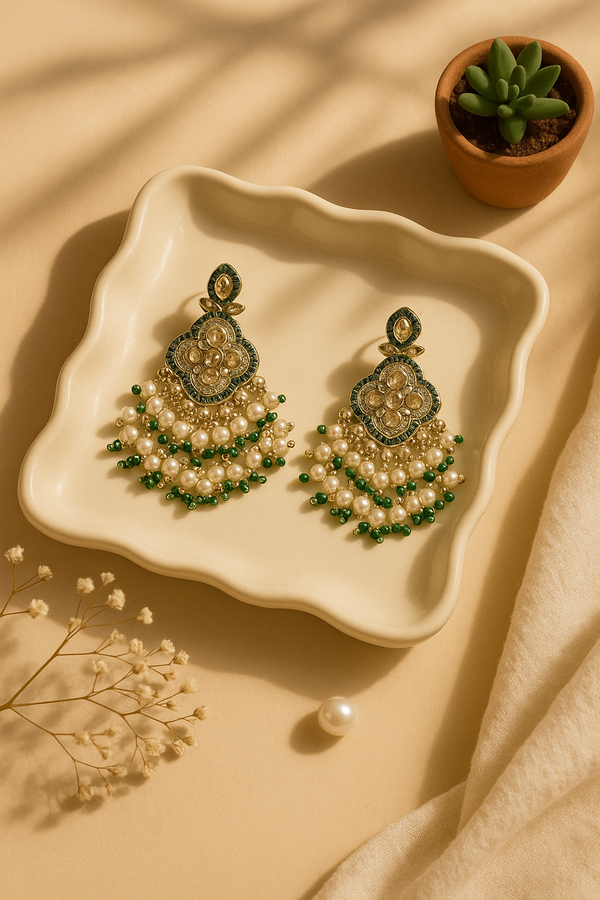Pearl and kundan jhumka earrings with green beads
