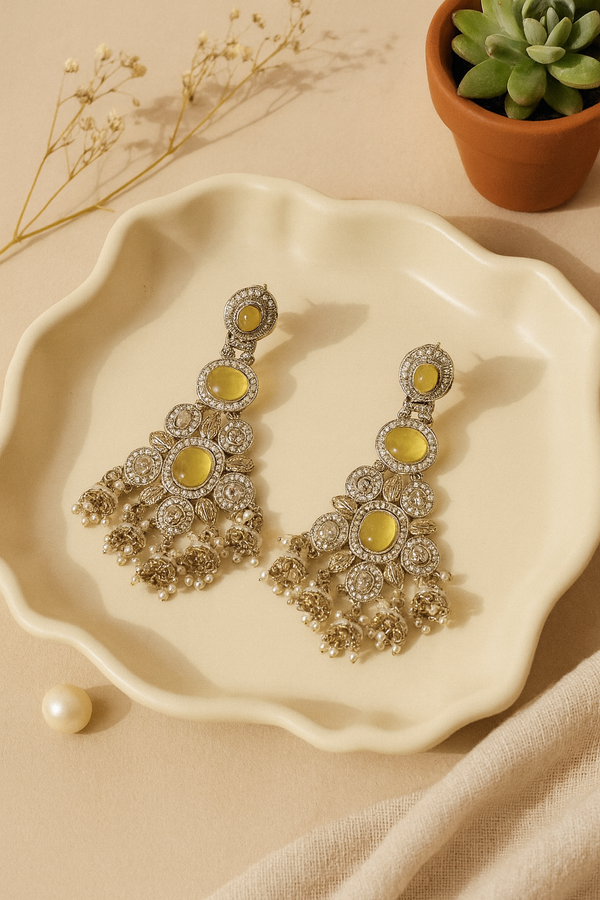 Yellow stone kundan chandbali earrings with pearl drops
