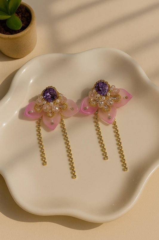 Korean statement earrings with pink petals and purple gem

