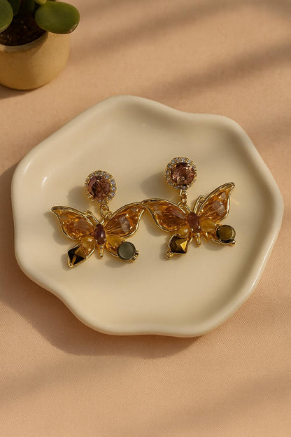 Korean butterfly earrings with amber crystals and gold plating
